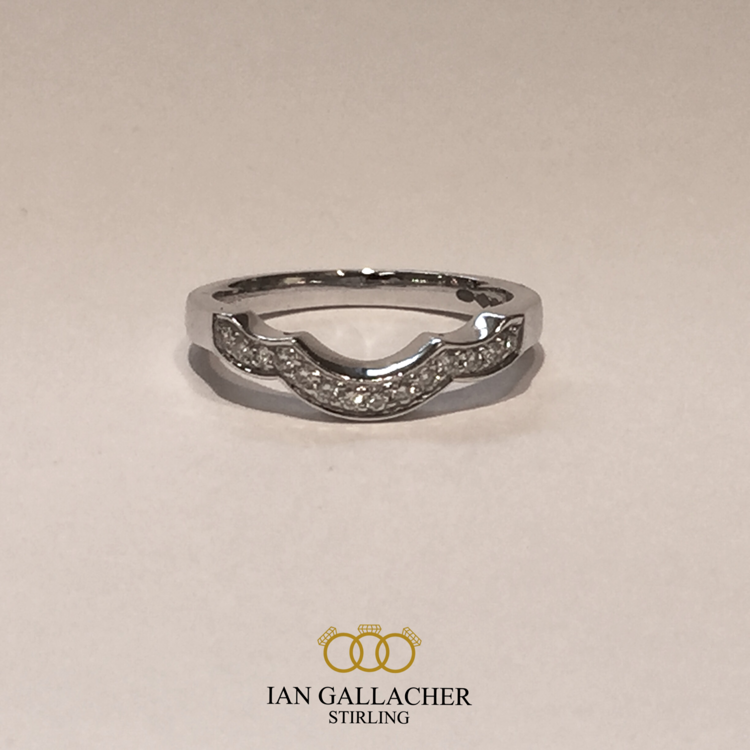 Platinum brilliant cut pave set shaped wedding ring