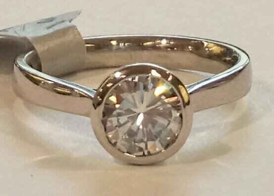 Platinum rubover solitaire ring