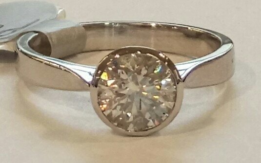 Platinum rubover solitaire ring