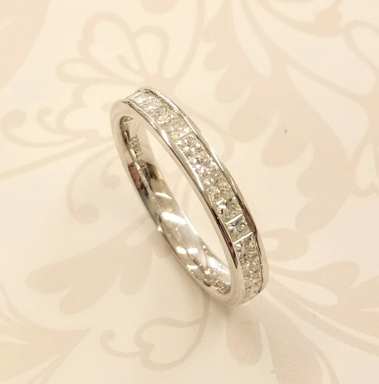 Platinum channel set wedding band 
