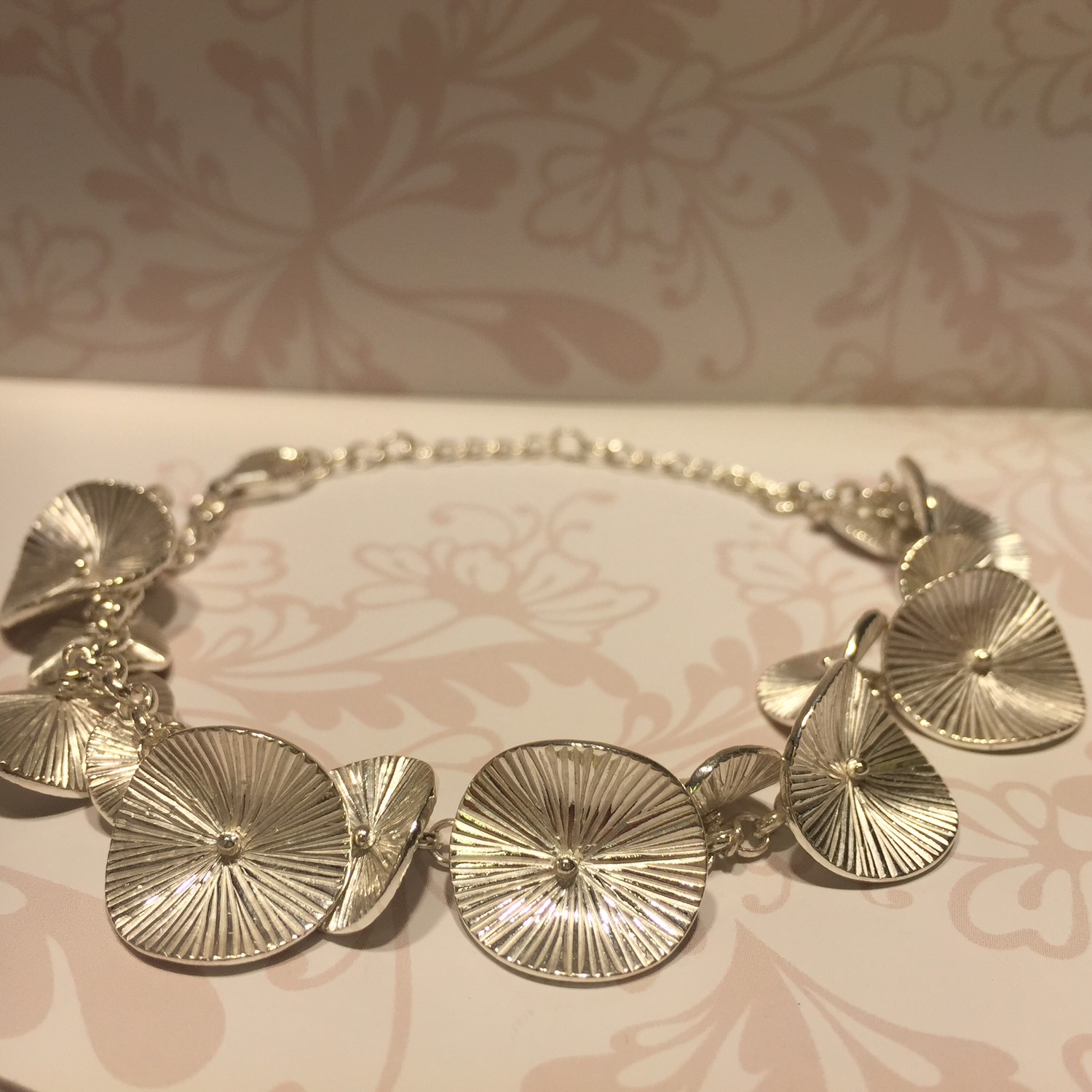 Silver bracelet with disk shaped pieces