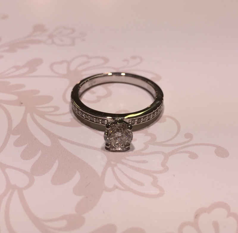 Platinum diamond solitaire with diamond shoulders