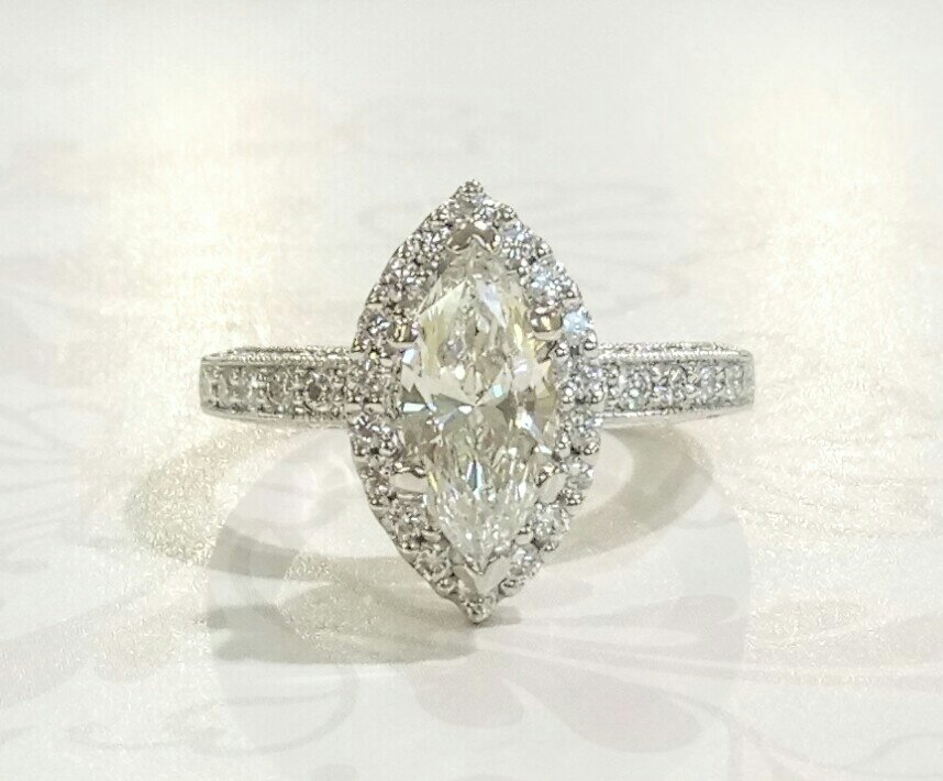 Platinum marquise diamond halo ring