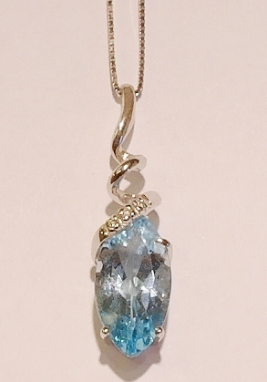 18ct white gold blue topaz and diamond pendant