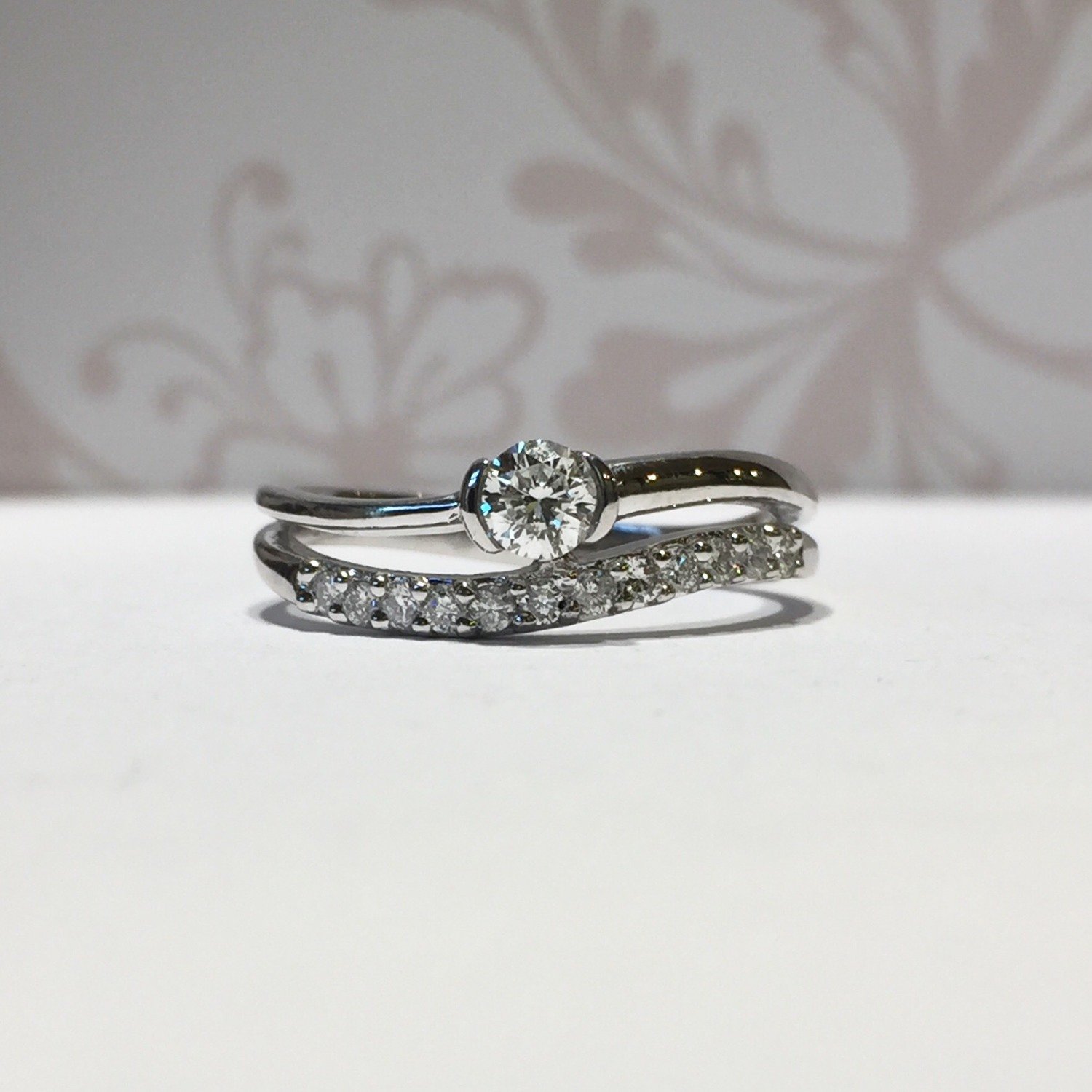 18ct white gold brilliant diamond and wave eternity ring