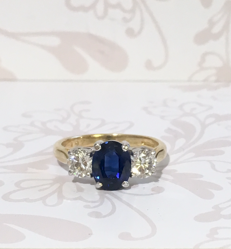 Yellow gold sapphire and diamond ring