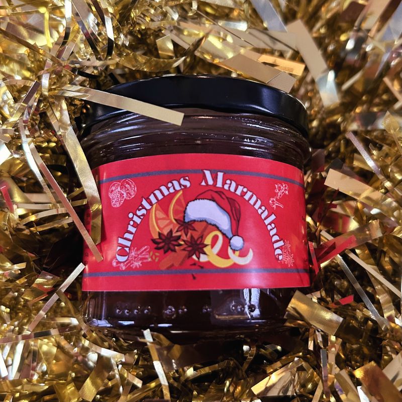 Jar of Christmas Marmalade by Case for Cooking on golden tinsel