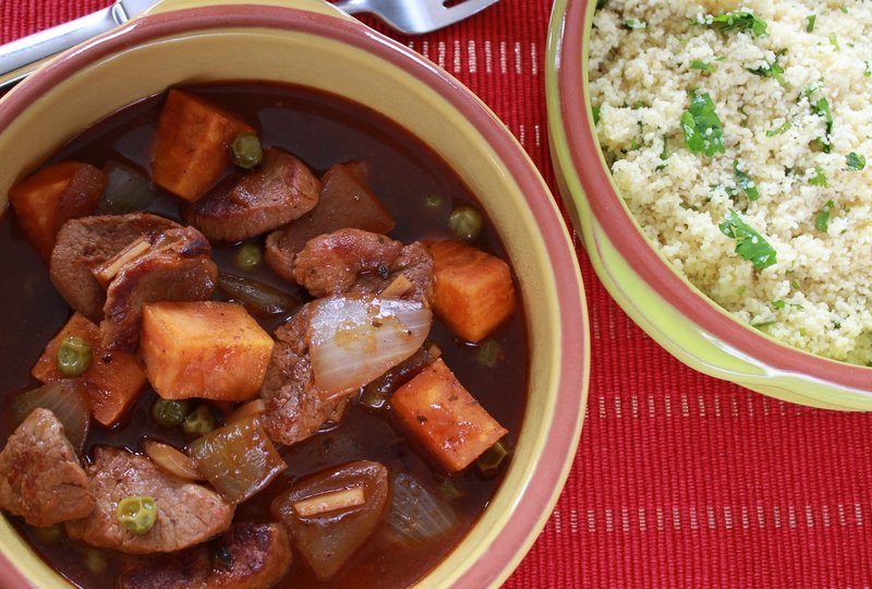 dish of spicy ginger pork made with a Case for Cooking spice rub and served with couscous