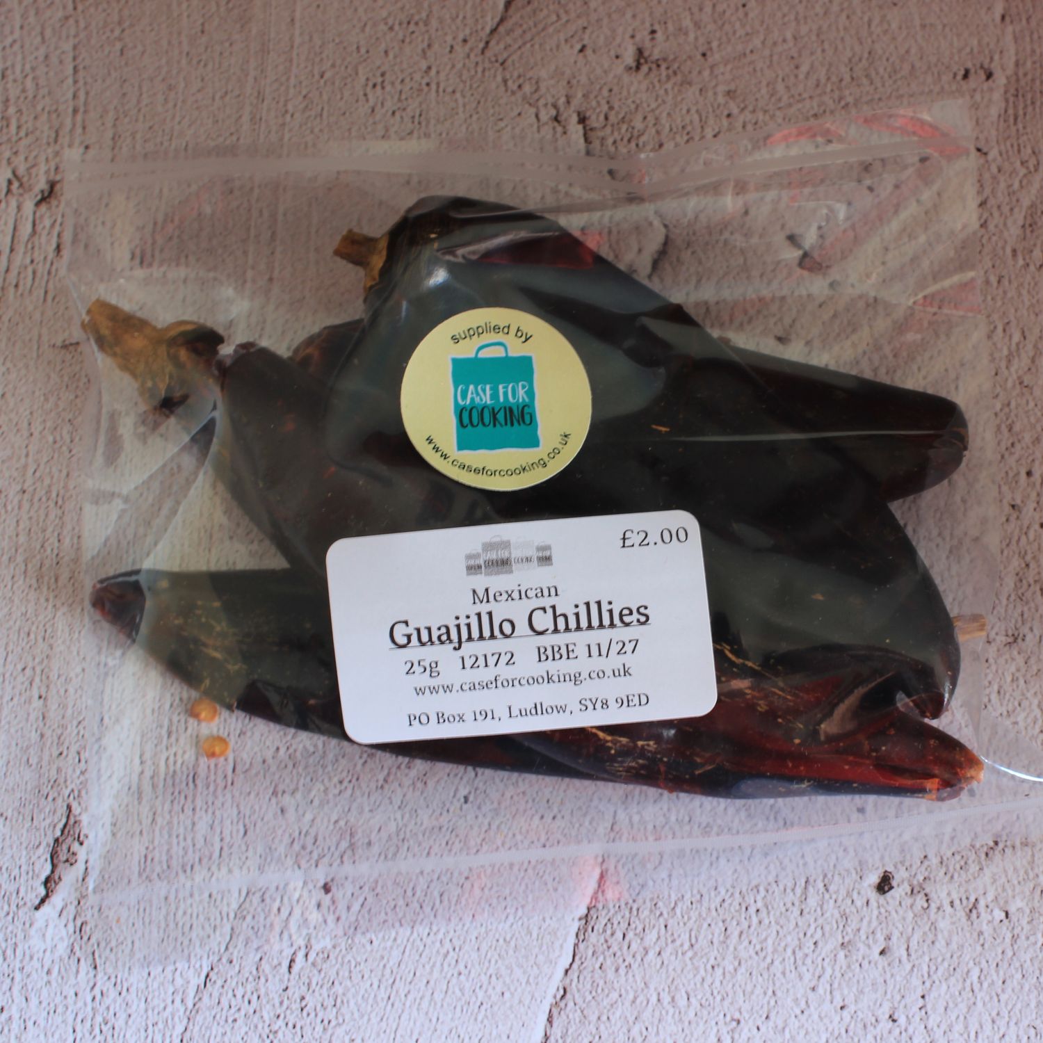 Packet of whole dried Guajillo chillies sold by Case for Cooking 