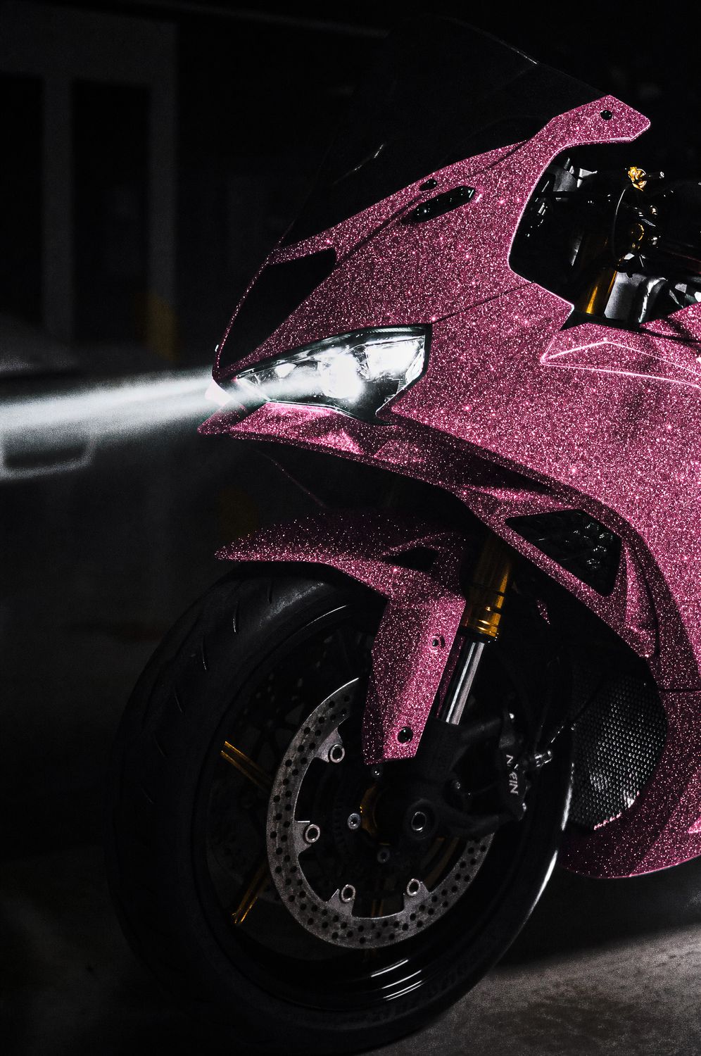 Pink diamond sparkle vinyl wrap on a motorcycle
