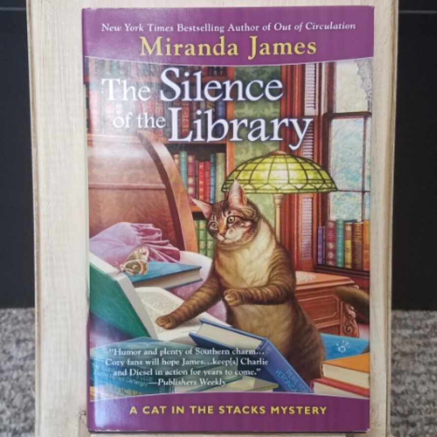 The Silence of the Library: A Cat in the Stacks Mystery by Miranda James