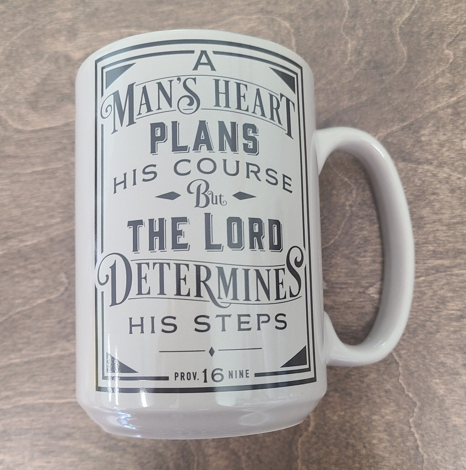 A Man's Heart Ceramic Coffee Mug in Brown - Proverbs 16:9