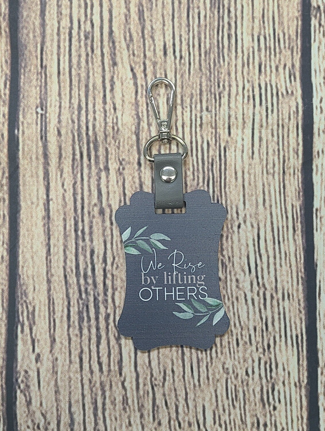 We Rise by Lifting Others Key Chain