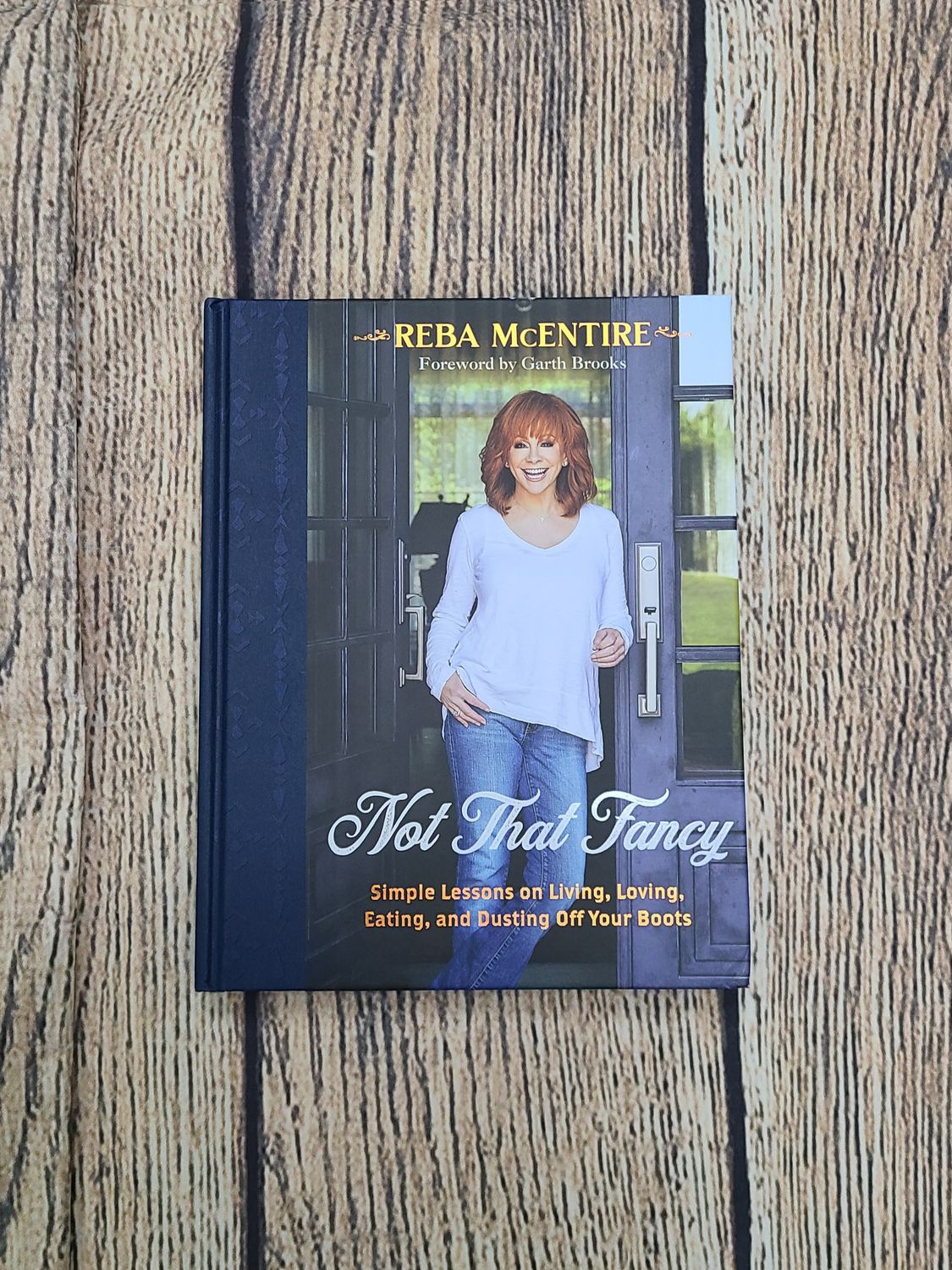 Not That Fancy: Simple Lessons on Living, Loving, Eating, and Dusting Off Your Boots by Reba McEntire and Foreword by Garth Brooks - Hardback - New