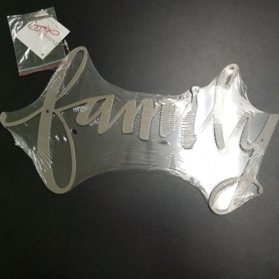 Precision cut "family" hand lettered sentiment in brushed metal wall hanging. Primitives by Kathy
