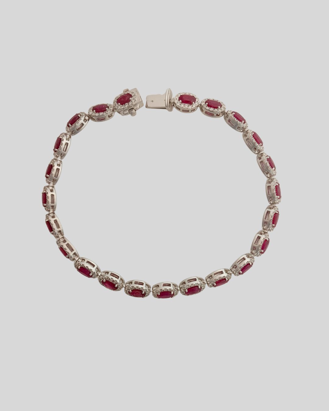 Oval Ruby and Diamond Halo Bracelet in 18ct White Gold