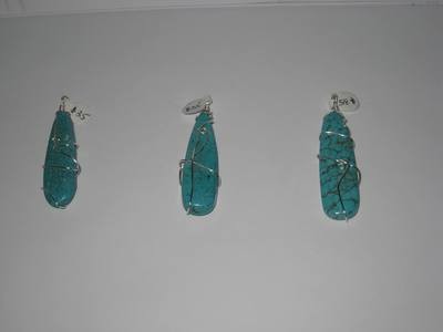 Turquoise stone wrapped pendents