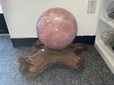 Rose Quartz Sphere on Tree Stump