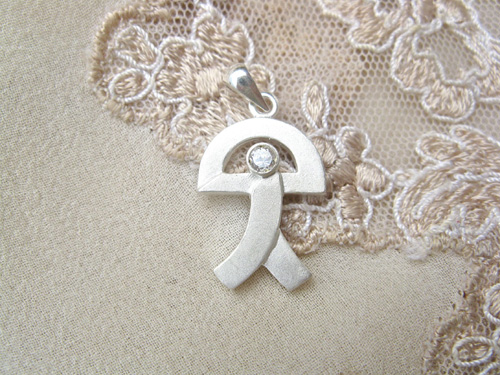 Indalo pendant ~ curved, silver + zirconite