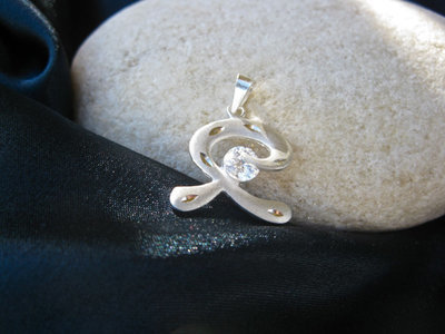 Indalo pendant ~ matte etched, silver + zirconite