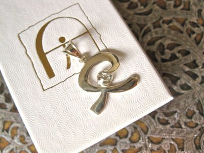 Indalo pendant ~  smooth, silver + zirconite