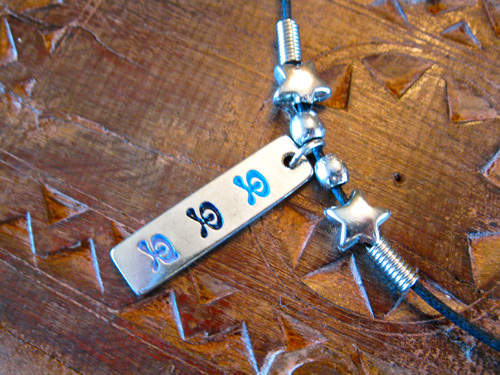 Indalo dog tag ~ trio, metal