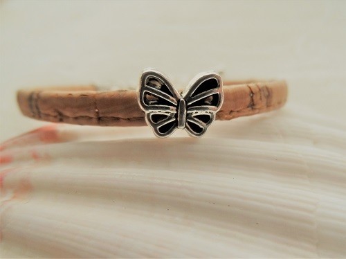 The butterfly charm is symbolic of new beginnings or starting a new venture