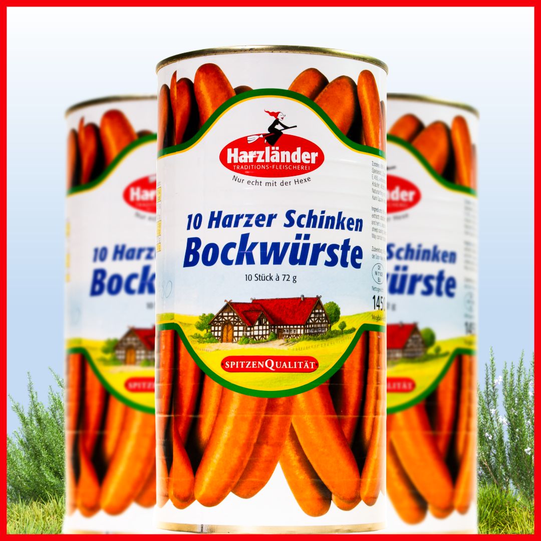 Three Harzlander sausage cans on grass, labeled “10 Harzer Schinken Bockwurst.”