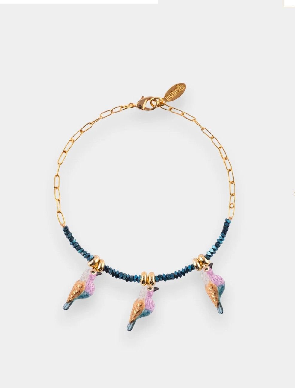 Bracelet en perles d’hématite et oiseaux porcelaine