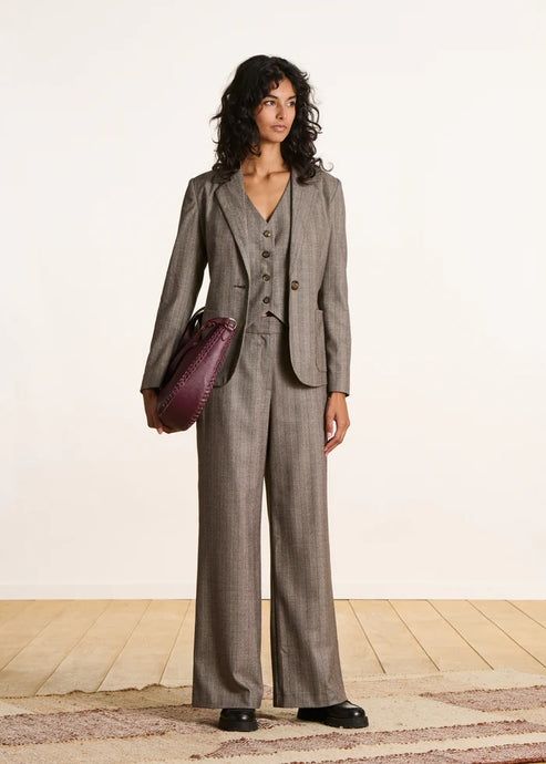 Veste ceinturée en tissu lurex à fines rayures