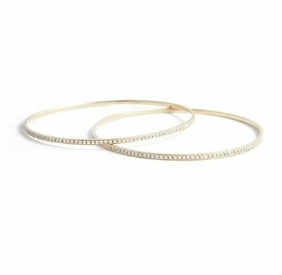 A Pair of 18kt Yellow Gold and Diamond Bangles