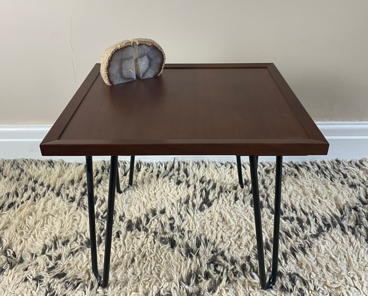 Warm walnut veneer 'Edie' side table with frame detail and steel hairpin legs