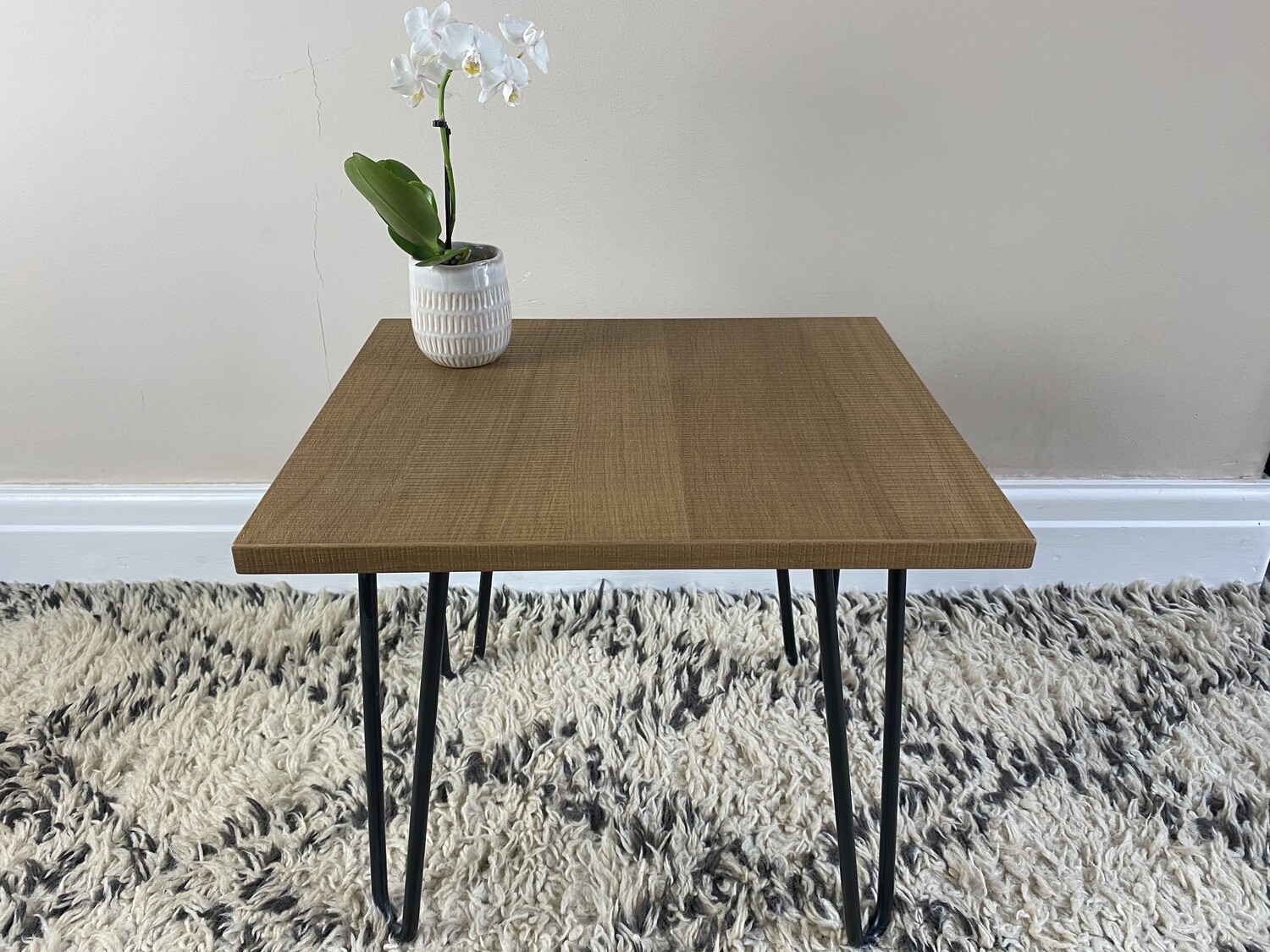 Textured walnut veneer 'Edie' side table with steel hairpin legs