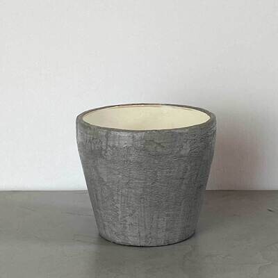 Round grey concrete plant pot