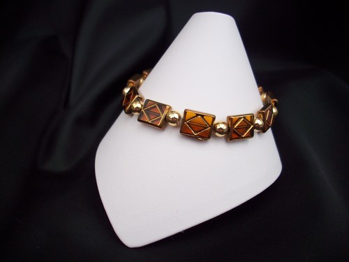 Brown glass with gold diamond accent