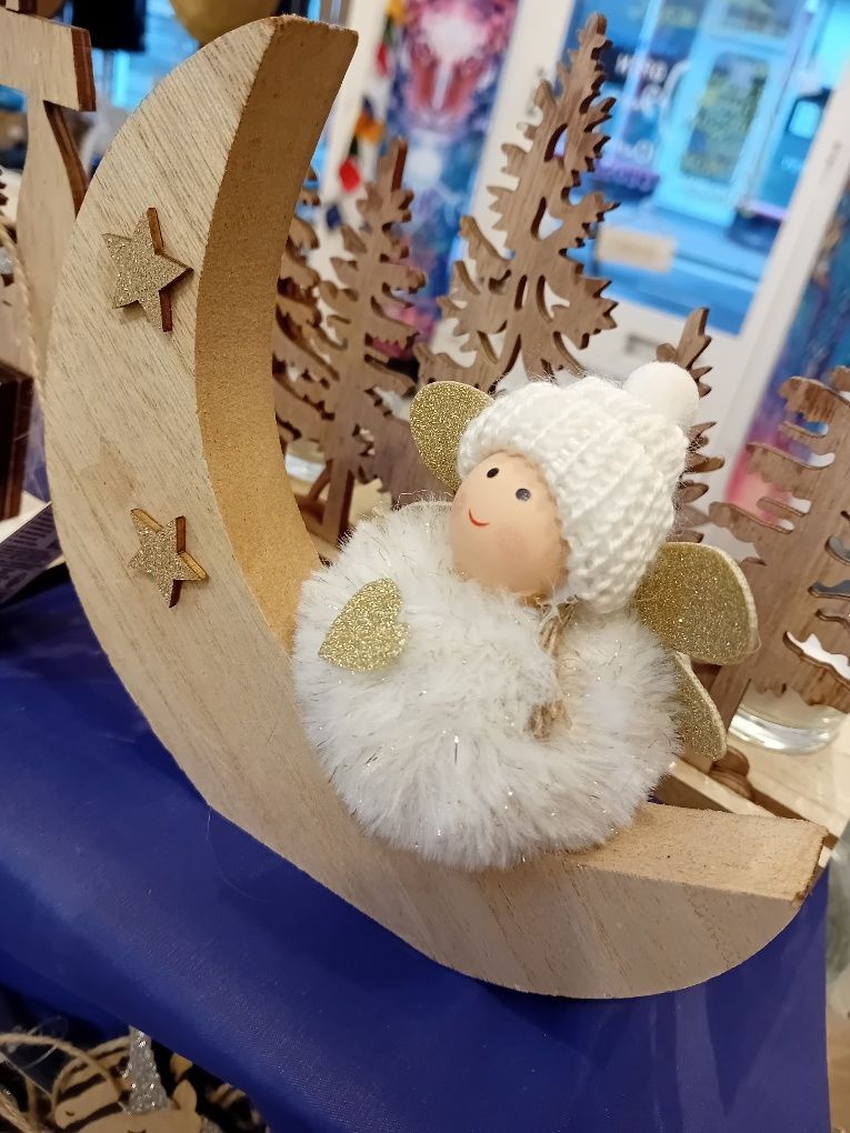 Pom Pom angel on crescent with stars