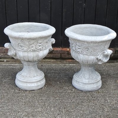 Lot 3,   A pair of reconstituted stone garden urns, 70cm high 80/120