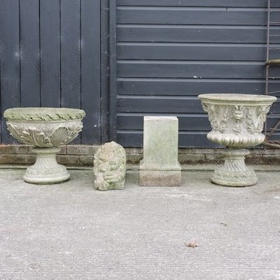 Lot 17, A reconstituted stone urn, 58cm high, together with a reconstituted stone planter on a pedestal base, a reconstituted stone lion and a pedestal 40/60 Lot 17, A reconstituted stone urn, 58cm high, together with a reconstituted stone planter on a pedestal base, a reconstituted stone lion and a pedestal 40/60