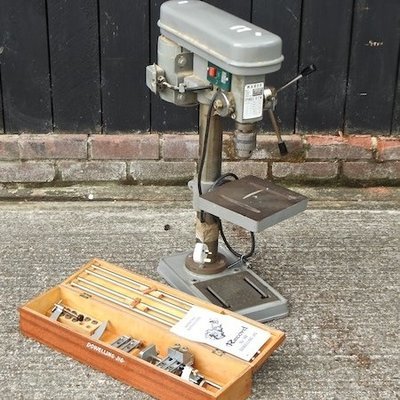 Lot 38,   A Warco bench pillar drill, together with a Record dowelling jug, boxed 40/60