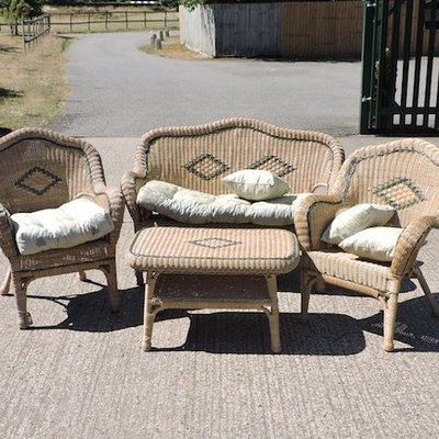Lot 59,   A rattan conservatory set, comprising of a sofa 130cm, two armchairs and a coffee table 30/40