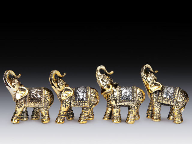 4 MINIATURE GOLDEN TONE ELEPHANTS