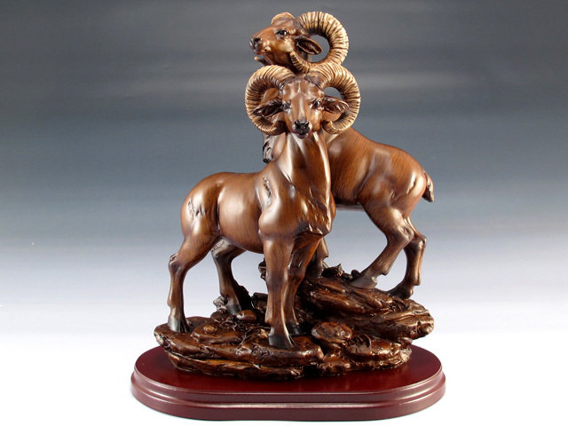 TWO MAHOGANY RAMS