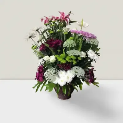 handcrafted ceramic vase, featuring a carefully selected variety of fresh flowers