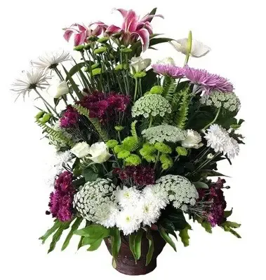handcrafted ceramic vase, featuring a carefully selected variety of fresh flowers