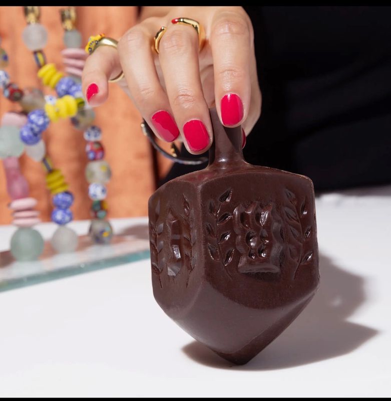 Fine & Raw By Wild Curves: Mega Chocolate Dreidel (70% Dark Chocolate Organic, Kosher) Fine & Raw By Wild Curves: Mega Chocolate Dreidel (70% Dark Chocolate Organic, Kosher) Front