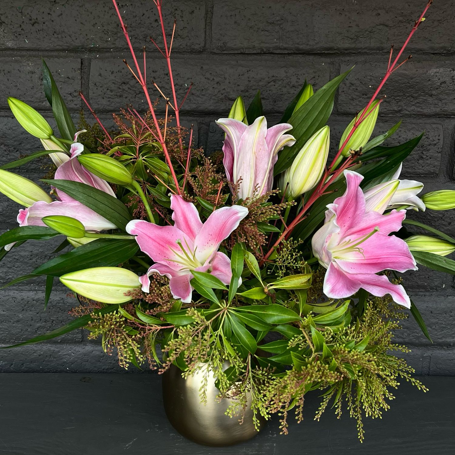 LILIES IN BRASS VASE