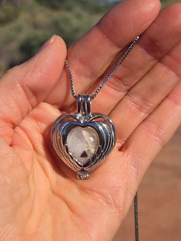 Sedona White light Singing Crystal Angel Wings Heart Locket with Red Rock Pyramid (Crystal City of Light) Light Sale $444.00 was $555.00 Sedona White light Singing Crystal Angel Wings Heart Locket with Red Rock Pyramid (Crystal City of Light) Light Sale $444.00 was $555.00