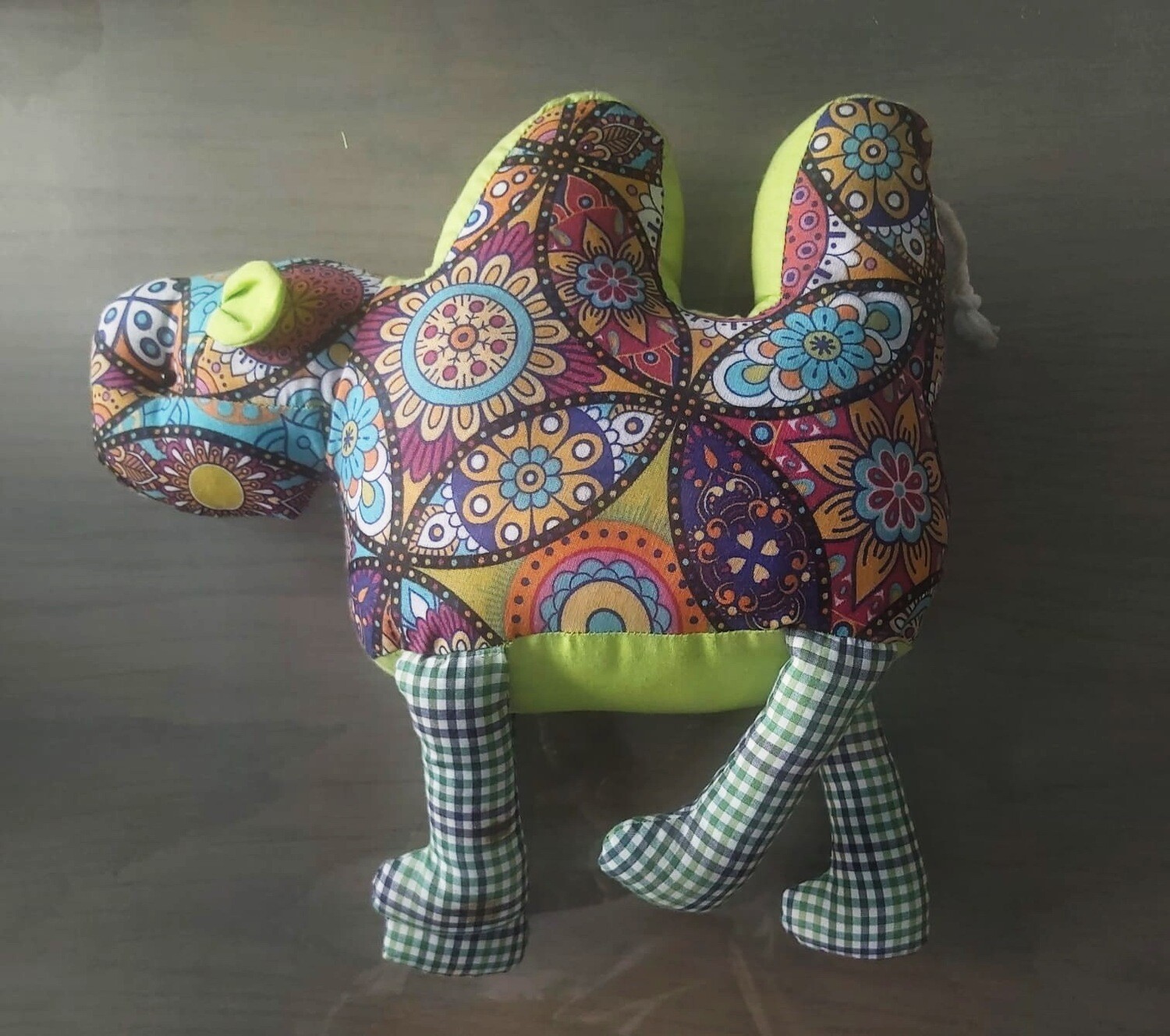 Camel in green with geometric design