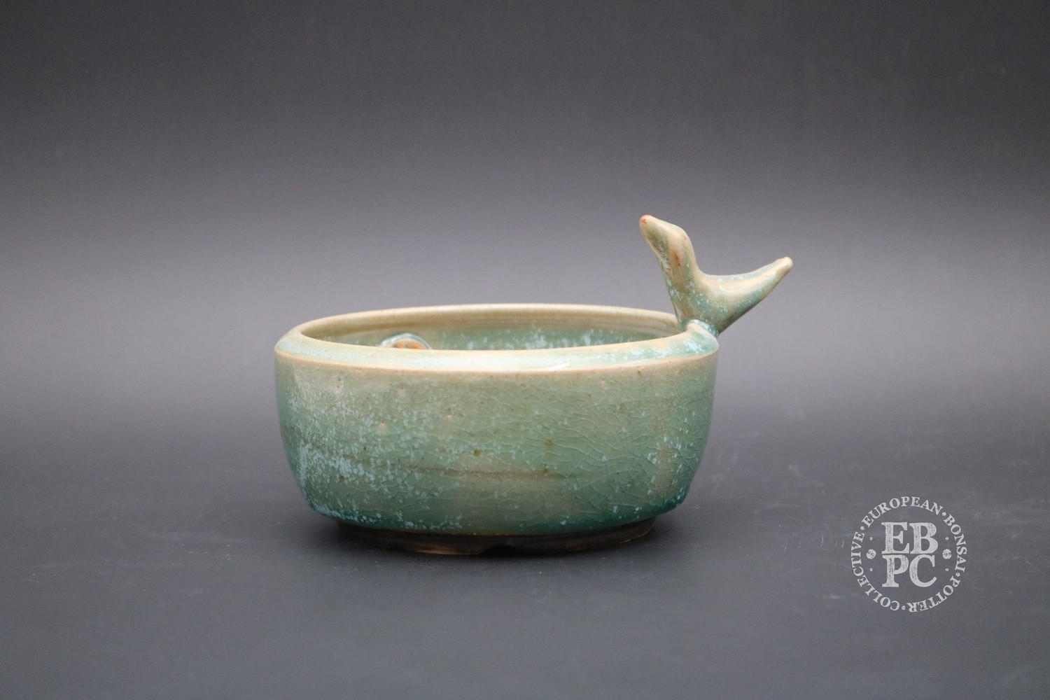 SOLD - Sabine Besnard - 11.6cm; Shohin pot; Round; Green glaze, Aqua; Sculpted trademark accent bird