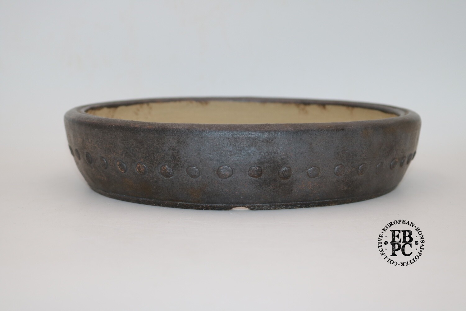 SOLD - Ian Baillie - 27.8cm; Round; Drum Style;  Studs; Oxide Glaze; Unglazed;  Brown; Stunning Finish